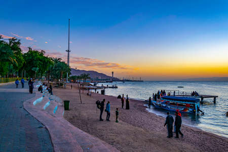 AQABA, JORDAN, JANUARY 5, 2019: People are enjoying a sunset on a beach in Aqaba, Jordanのeditorial素材