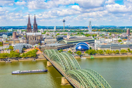 Aerial view of the cathedral in Cologne and Hohenzollern bridge over Rhein, Germanyの写真素材