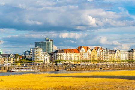 Colorful houses at riverside promenade in Dusseldorf, Germanyの写真素材