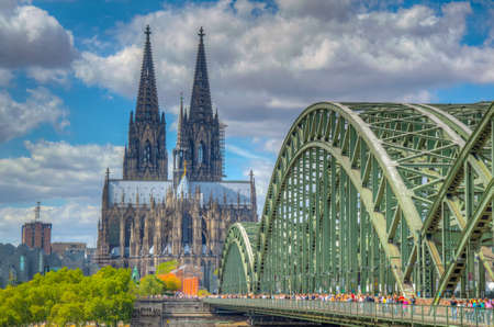Cathedral in Cologne and Hohenzollern bridge over Rhein, Germanyの写真素材