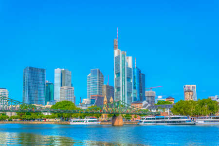 FRANKFURT, GERMANY, AUGUST 18, 2018: Skyscrapers in frankfurt viewed behind church of saint leonhard, Germanyのeditorial素材
