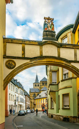 TRIER, GERMANY, AUGUST 14, 2018: People are passing by the Cathedral in Trier, Germanyのeditorial素材