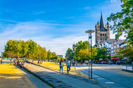 COLOGNE, GERMANY, AUGUST 11, 2018: Riverside promenade and Saint Martin church in Cologne, Germanyのeditorial素材