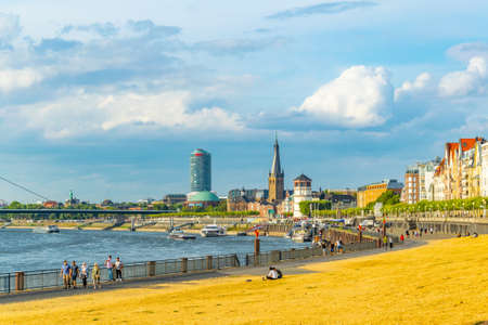 DUSSELDORF, GERMANY, AUGUST 9, 2018: Riverside of Rhein in Dusseldorf with Saint Lambertus church, Germanyのeditorial素材