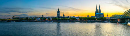 COLOGNE, GERMANY, AUGUST 11, 2018: Sunset view of cityscape of Cologne with Hohenzollern bridge, cathedral and Saint Martin church, Germanyのeditorial素材
