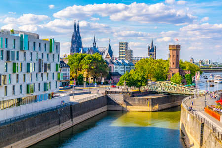 COLOGNE, GERMANY, AUGUST 11, 2018: People are passing between Malakoffturm tower and Chocolate museum in Cologne, Germanyのeditorial素材