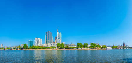 FRANKFURT, GERMANY, AUGUST 18, 2018: Skyscrapers in frankfurt viewed behind church of saint leonhard, Germanyのeditorial素材