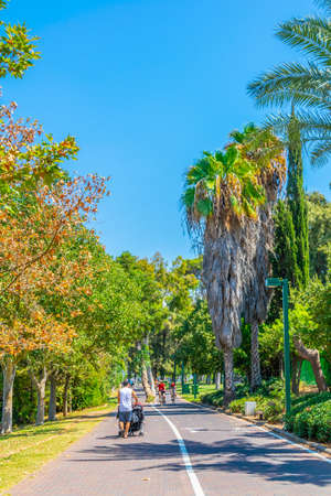 TEL AVIV, ISRAEL, SEPTEMBER 10, 2018: People are enjoying a sunny day at a promenade alongside river Yarkon in Tel Aviv, Israelのeditorial素材