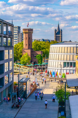 COLOGNE, GERMANY, AUGUST 11, 2018: People are passing between Malakoffturm tower and Chocolate museum in Cologne, Germanyのeditorial素材