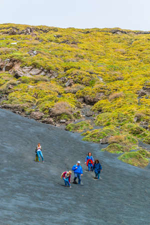 ETNA, ITALY, APRIL 28, 2017: a group of tourist is descending from mount etna in sicily, Italyのeditorial素材