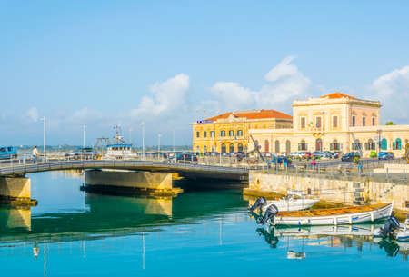 Boats are moored next to the old town of Syracuse, Sicily, Italyのeditorial素材