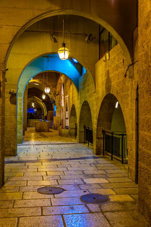 JERUSALEM, ISRAEL, SEPTEMBER 6, 2018: People are strolling among various shops situated in a narrow street in the old town of Jerusalem, Israelのeditorial素材