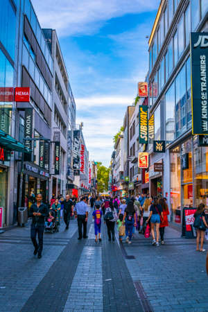 COLOGNE, GERMANY, AUGUST 11, 2018: People are passing through center of Cologne, Germanyのeditorial素材