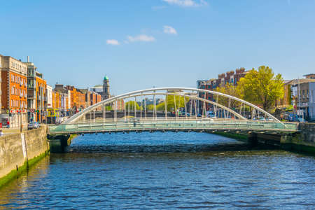 Riverside of Liffey dominated by Saint Paul's church in Dublin, Irelandのeditorial素材