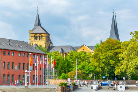 TRIER, GERMANY, AUGUST 14, 2018: People are passing by the Cathedral in Trier, Germany