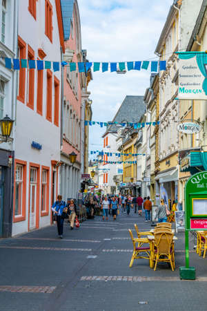 TRIER, GERMANY, AUGUST 14, 2018: People strolling through a narrow street in trier, Germanyのeditorial素材