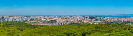 Aerial view of Lisbon dominated by an ancient aqueduct, Portugal