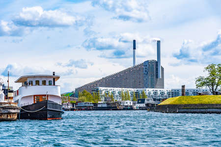 View of Amager Bakke factory with skiing slope on the rooftop in Copenhagen, Denmark