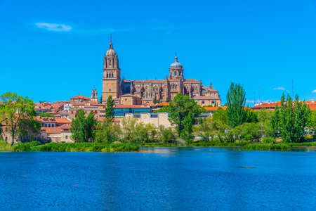 Cathedral at Salamanca reflected on river Tormes, Spainの写真素材