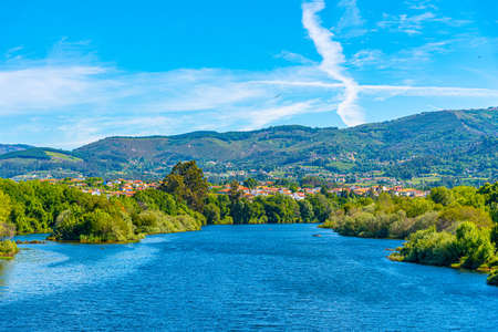 Lima river passing Ponte de Lima village in Portugalの写真素材