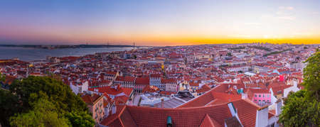 Sunset view of cityscape of Lisbon with Santa Justa lift, PortugalSunset view of cityscape of...