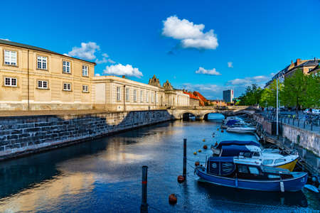View of a channel next to the Christiansborg Slot Palace in Copenhagen, Denmark.
