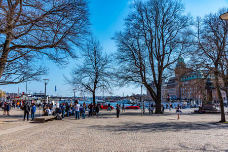 STOCKHOLM, SWEDEN, APRIL 20, 2019: People are strolling through Berzelii park in Stockholm, Swedenの写真素材