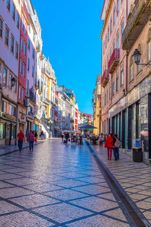 COIMBRA, PORTUGAL, MAY 20, 2019: People are strolling through boulevard Ferreira Borges at central Coimbra, Portugalの写真素材