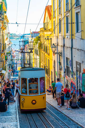 LISBON, PORTUGAL, JUNE 1, 2019: People are waiting for Elevador la Bica tram in Lisbon, Portugalの写真素材