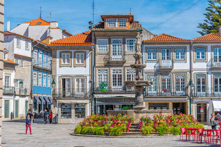VIANA DO CASTELO, PORTUGAL, MAY 24, 2019: People are strolling in front of Misericordia church at Placa da Republica square at Viana do Castelo in Portugalのeditorial素材