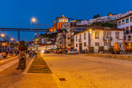 PORTO, PORTUGAL, MAY 25, 2019: Sunset view of Douro riverside at Ribeira quay at Porto, Portugalのeditorial素材