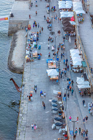 PORTO, PORTUGAL, MAY 25, 2019: Sunset view of Douro riverside at Ribeira quay at Porto, Portugalのeditorial素材