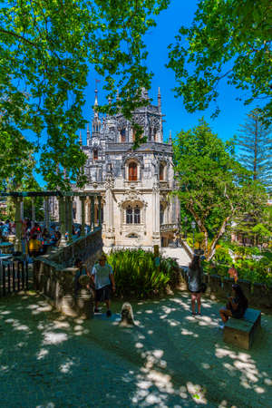 SINTRA, PORTUGAL, MAY 30, 2019: People are strolling through grounds of Quinta da Regaleira palace in Sintra, Portugalのeditorial素材