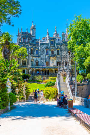 SINTRA, PORTUGAL, MAY 30, 2019:  People are strolling through grounds of Quinta da Regaleira palace in Sintra, Portugalのeditorial素材