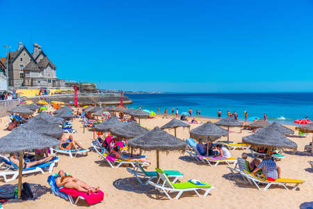CASCAIS, PORTUGAL, MAY 31, 2019: Palace of duques of palmela viewed behind Duquesa beach in Cascais, Portugalのeditorial素材