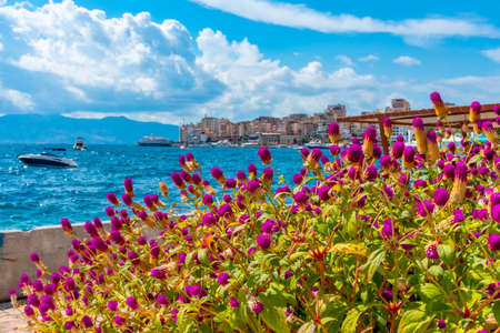Seaside promenade at Sarande viewed behind flowers, Albaniaの写真素材