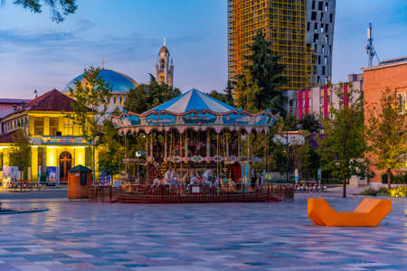 TIRANA, ALBANIA, SEPTEMBER 29, 2019: Sunrise view of Carousel at Skanderbeg square in Tirana, Albaniaのeditorial素材