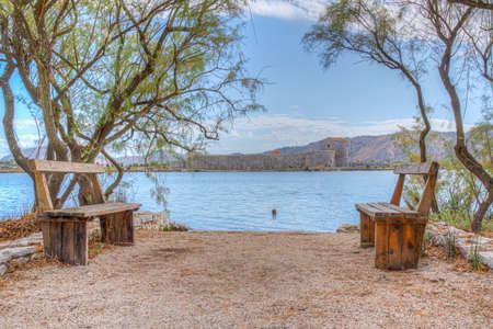 Benches and Venetian Triangle Castle at Butrint, Albaniaのeditorial素材