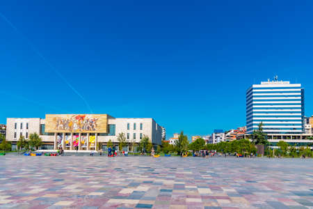 TIRANA, ALBANIA, SEPTEMBER 28, 2019: People are strolling in front of the National History museum in...
