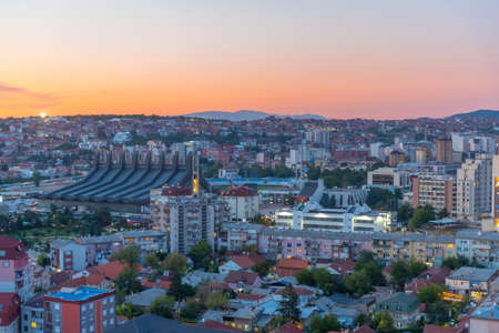 Sunset view fo landscape of Prishtina with Palace of Youth and Sports in Kosovoのeditorial素材