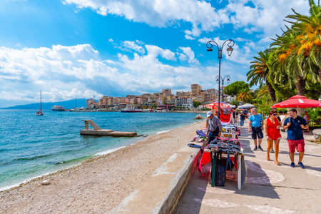 SARANDE, ALBANIA, SEPTEMBER 26, 2019: People are walking on seaside promenade at Sarande, Albaniaのeditorial素材