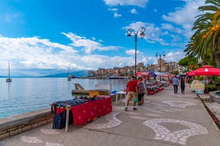 SARANDE, ALBANIA, SEPTEMBER 26, 2019: People are walking on seaside promenade at Sarande, Albaniaのeditorial素材