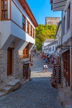 GJIROKASTER, ALBANIA, SEPTEMBER 25, 2019: People are strolling through old town of Gjirokaster, Albaniaのeditorial素材