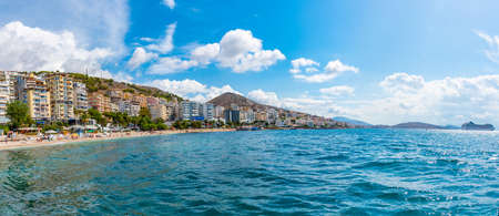 SARANDE, ALBANIA, SEPTEMBER 24, 2019: People are enjoying a sunny day on a beach at Sarande, Albaniaのeditorial素材