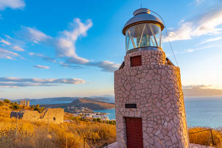 Ragged coastline of Sarande viewed behind a lighthouse, Albaniaのeditorial素材