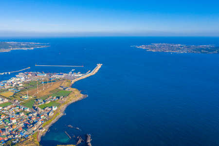 Aerial view of Seongsan village at Jeju island, Republic of Koreaの写真素材