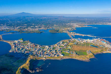 Aerial view of Seongsan village at Jeju island, Republic of Koreaの写真素材