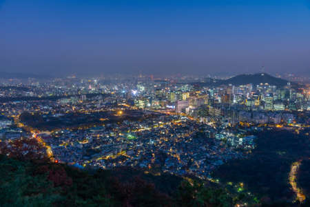 Night view of Namsan tower overlooking Gyeongbokgung palace and downtown Seoul, Republic of Koreaの写真素材