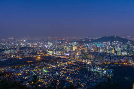 Night view of Namsan tower overlooking Gyeongbokgung palace and downtown Seoul, Republic of Koreaの写真素材