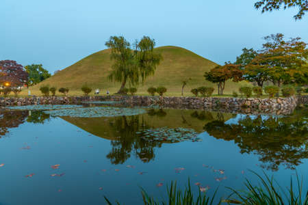 Sunset view of Tumuli park containing several royal tombs, Gyeongju, Republic of Koreaの写真素材